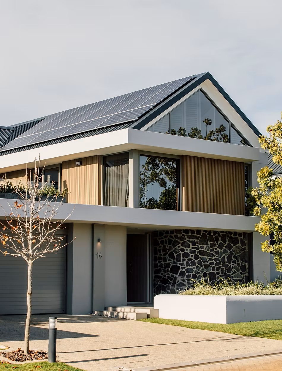 Residential concept with a pitched roof, balcony and stone wall
