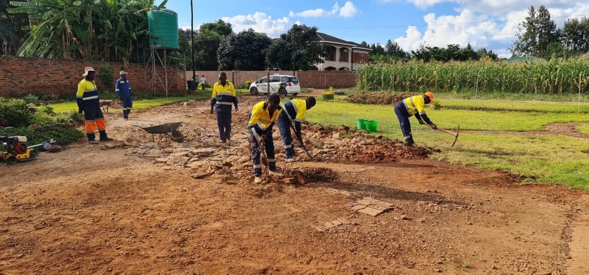 Workers preparing an outdoor site for landscaping.