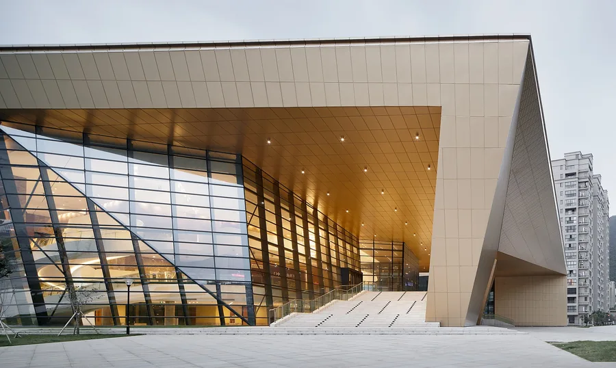 Contemporary commercial building with a glazed facade and a deep projecting roof